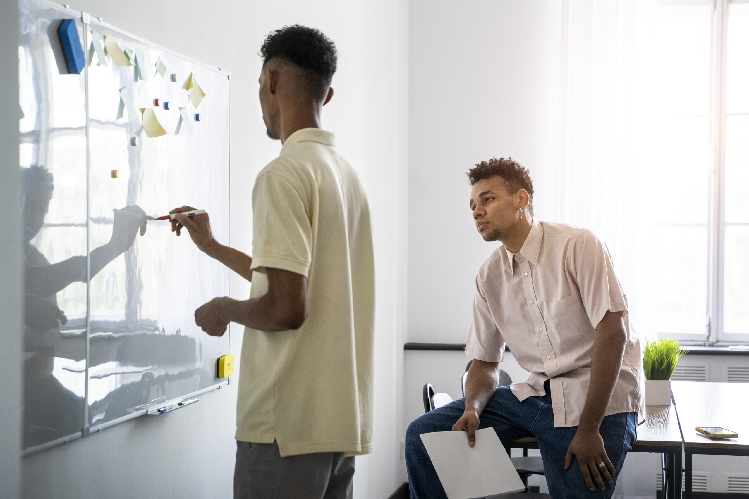 side-view-man-writing-whiteboard
